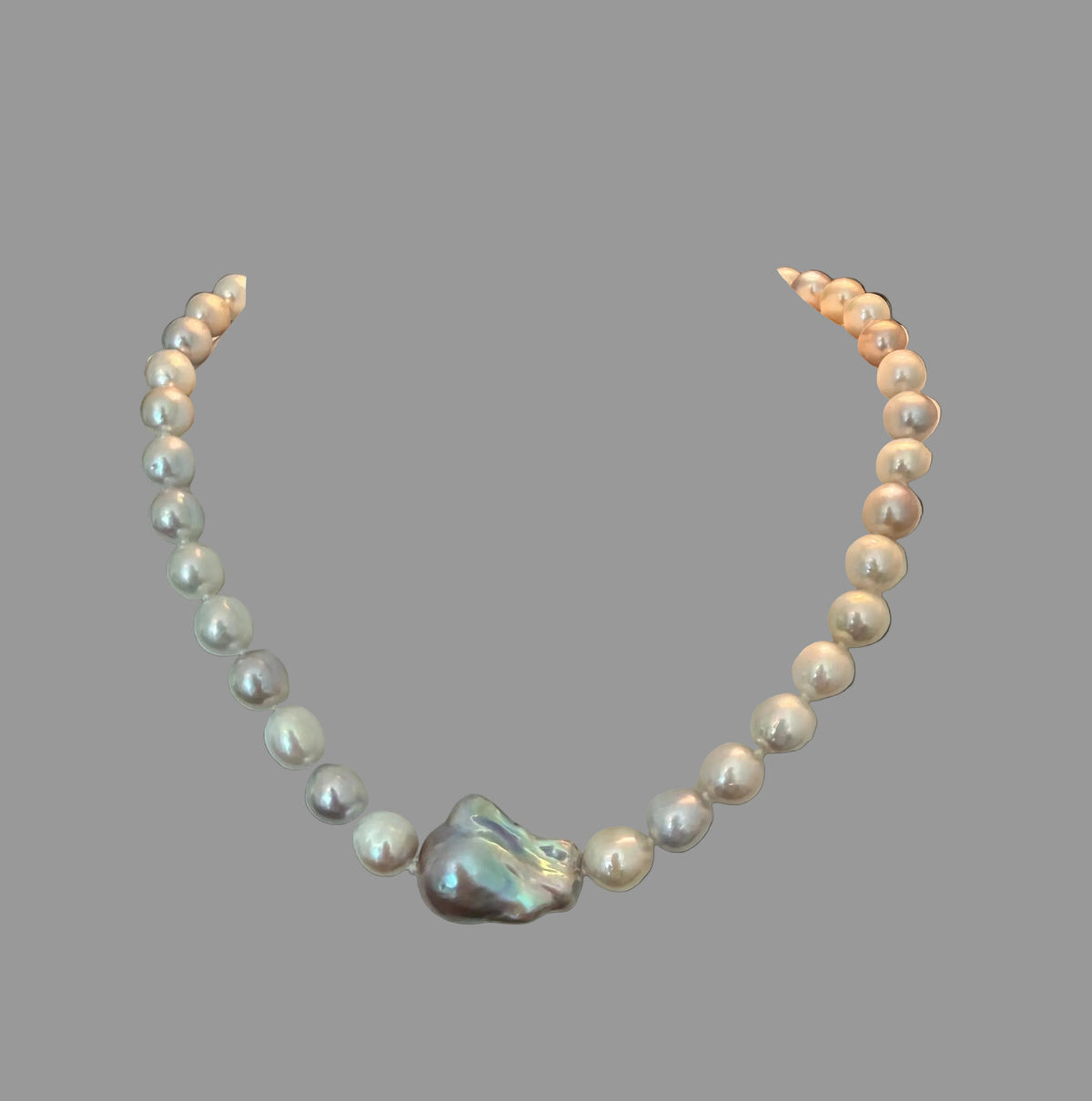 Tri-Color Japanese Pearls with a Freshwater Pearl Centerpiece